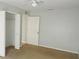 Well-lit bedroom with neutral walls and carpeting, including a double door closet at 66 Wylam Dr, Port Charlotte, FL 33954