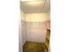 Walk-in closet with wire shelving and wooden shelving unit at 66 Wylam Dr, Port Charlotte, FL 33954