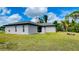 House exterior showcasing a well maintained lawn at 66 Wylam Dr, Port Charlotte, FL 33954