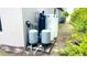 Exterior water system with multiple tanks and pumps at 66 Wylam Dr, Port Charlotte, FL 33954