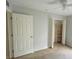 Well-lit bedroom with a closet and neutral decor at 66 Wylam Dr, Port Charlotte, FL 33954