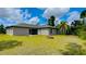 House exterior showcasing a well maintained lawn at 66 Wylam Dr, Port Charlotte, FL 33954