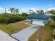 Aerial view of a single-story house with paver driveway at 14242 Imlay Ave, Port Charlotte, FL 33981