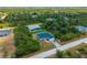 Aerial view of two single story homes in a neighborhood at 14242 Imlay Ave, Port Charlotte, FL 33981