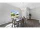 Bright dining room with tiled floors and large window at 14242 Imlay Ave, Port Charlotte, FL 33981
