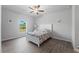 Bright bedroom with tile floors and a white bed frame at 14242 Imlay Ave, Port Charlotte, FL 33981