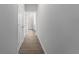 Clean hallway with tile flooring leading to bedrooms and bathroom at 14242 Imlay Ave, Port Charlotte, FL 33981