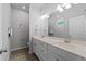 Double vanity bathroom with modern fixtures and tile flooring at 13409 Warba Ave, Port Charlotte, FL 33981