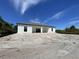 New construction home with gray roof and white exterior at 13409 Warba Ave, Port Charlotte, FL 33981