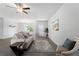Bright living room features a neutral couch and tile floors at 13409 Warba Ave, Port Charlotte, FL 33981