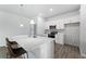 Modern kitchen island with white cabinets and quartz countertops at 13409 Warba Ave, Port Charlotte, FL 33981