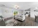 Open-concept living room and kitchen with wood-look floors at 13409 Warba Ave, Port Charlotte, FL 33981