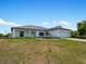 Single-story home with attached garage and landscaping at 13409 Warba Ave, Port Charlotte, FL 33981