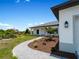Landscaped walkway leading to the front door of a new home at 13409 Warba Ave, Port Charlotte, FL 33981