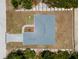 Overhead view of a new house with a gray roof, showing a paved driveway and landscaping at 13409 Warba Ave, Port Charlotte, FL 33981