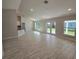 Open living room with tile floors and access to patio at 4051 Dotham St, Port Charlotte, FL 33948