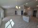 Island kitchen with granite countertops and stainless steel appliances at 4051 Dotham St, Port Charlotte, FL 33948
