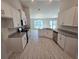 Modern kitchen with white cabinets and granite countertops at 4051 Dotham St, Port Charlotte, FL 33948