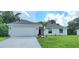 One-story home with attached garage and landscaped yard at 4051 Dotham St, Port Charlotte, FL 33948