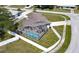 Aerial view of house and fenced backyard with pool at 22260 Aburto Ln, Port Charlotte, FL 33952