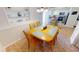 Bright dining room with wood table and chairs, kitchen view at 22260 Aburto Ln, Port Charlotte, FL 33952