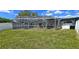 Large backyard with screened pool and fenced enclosure at 22260 Aburto Ln, Port Charlotte, FL 33952