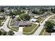 Aerial view of single-Gathering home with pool and fenced backyard, located in a residential neighborhood at 22260 Aburto Ln, Port Charlotte, FL 33952