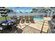 Relaxing poolside patio with seating and umbrella at 22260 Aburto Ln, Port Charlotte, FL 33952