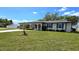 Charming ranch home with landscaped lawn at 22260 Aburto Ln, Port Charlotte, FL 33952