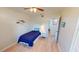 Small bedroom with a twin-size bed and adjacent bathroom at 22260 Aburto Ln, Port Charlotte, FL 33952