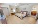 Spacious primary bedroom with a king bed and views to the dining area at 22260 Aburto Ln, Port Charlotte, FL 33952