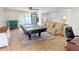 Game room with pool table, seating area, and pool access at 22260 Aburto Ln, Port Charlotte, FL 33952