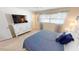 Spacious bedroom with king-size bed and large TV at 22260 Aburto Ln, Port Charlotte, FL 33952