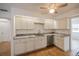 Updated kitchen, granite countertops, and white cabinets at 20567 Midway Blvd, Port Charlotte, FL 33952