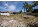 Large backyard with a spacious patio area and plenty of room for outdoor activities at 20567 Midway Blvd, Port Charlotte, FL 33952
