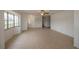 Living area with tile floors, bay window, and access to other rooms at 20567 Midway Blvd, Port Charlotte, FL 33952