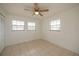 Bedroom with tile floors and ceiling fan at 20567 Midway Blvd, Port Charlotte, FL 33952