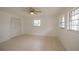 Spacious bedroom with tile flooring and ceiling fan at 20567 Midway Blvd, Port Charlotte, FL 33952