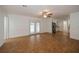 Living room with pool view, tile floors, and ceiling fan at 20567 Midway Blvd, Port Charlotte, FL 33952