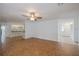 Living area with tile floors, kitchen view, and access to entry at 20567 Midway Blvd, Port Charlotte, FL 33952