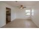 Dining area with tile floors, ceiling fan, and kitchen access at 20567 Midway Blvd, Port Charlotte, FL 33952