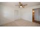 Bedroom with tile floors, ceiling fan, and closet at 20567 Midway Blvd, Port Charlotte, FL 33952