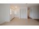 Spacious living room featuring tile floors and a view to the kitchen at 20567 Midway Blvd, Port Charlotte, FL 33952