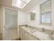 Bathroom with double vanity and granite countertops at 20567 Midway Blvd, Port Charlotte, FL 33952