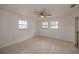 Bright bedroom with tile floors and ceiling fan at 20567 Midway Blvd, Port Charlotte, FL 33952