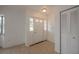 Bright entryway with tile flooring, white walls, and a coat closet at 20567 Midway Blvd, Port Charlotte, FL 33952