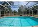Refreshing screened-in pool, perfect for relaxation and entertainment at 20567 Midway Blvd, Port Charlotte, FL 33952