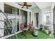 Outdoor balcony with seating for two and artificial turf at 5115 Melbourne St # A303, Port Charlotte, FL 33980