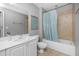 Bathroom with tub shower and white vanity at 5115 Melbourne St # A303, Port Charlotte, FL 33980