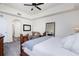 Bright main bedroom featuring a king bed and sitting area at 5115 Melbourne St # A303, Port Charlotte, FL 33980